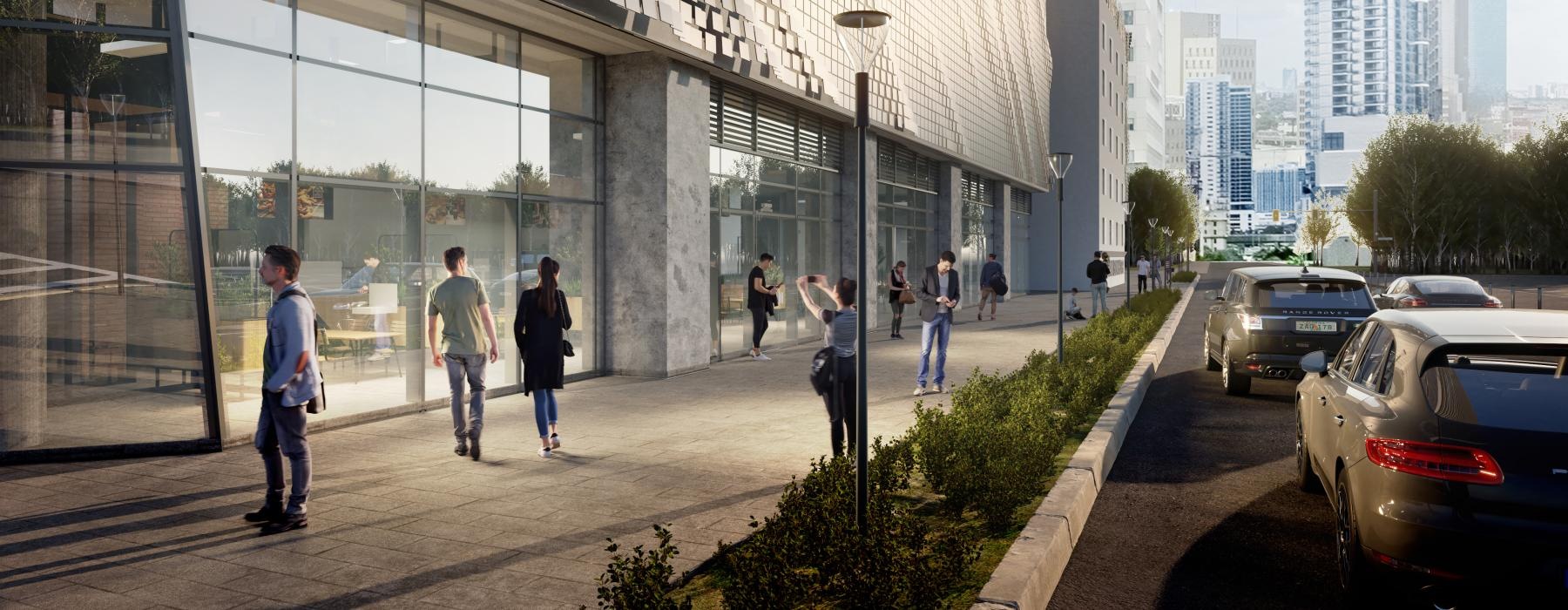 a street with cars and people walking on it next to a building