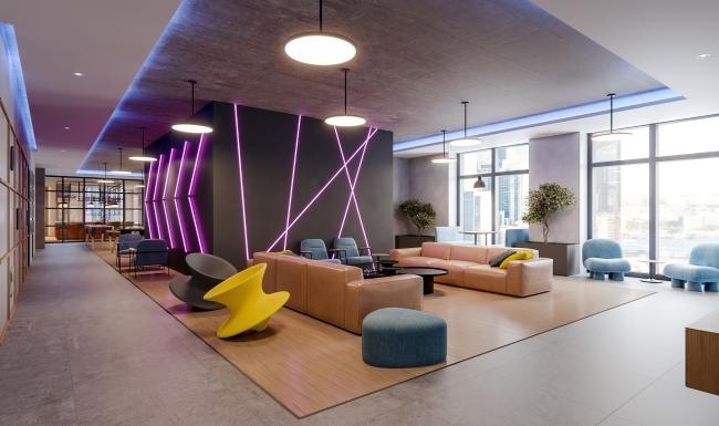 a room with large couch and  large windows