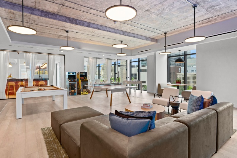 a room with a couch and chairs