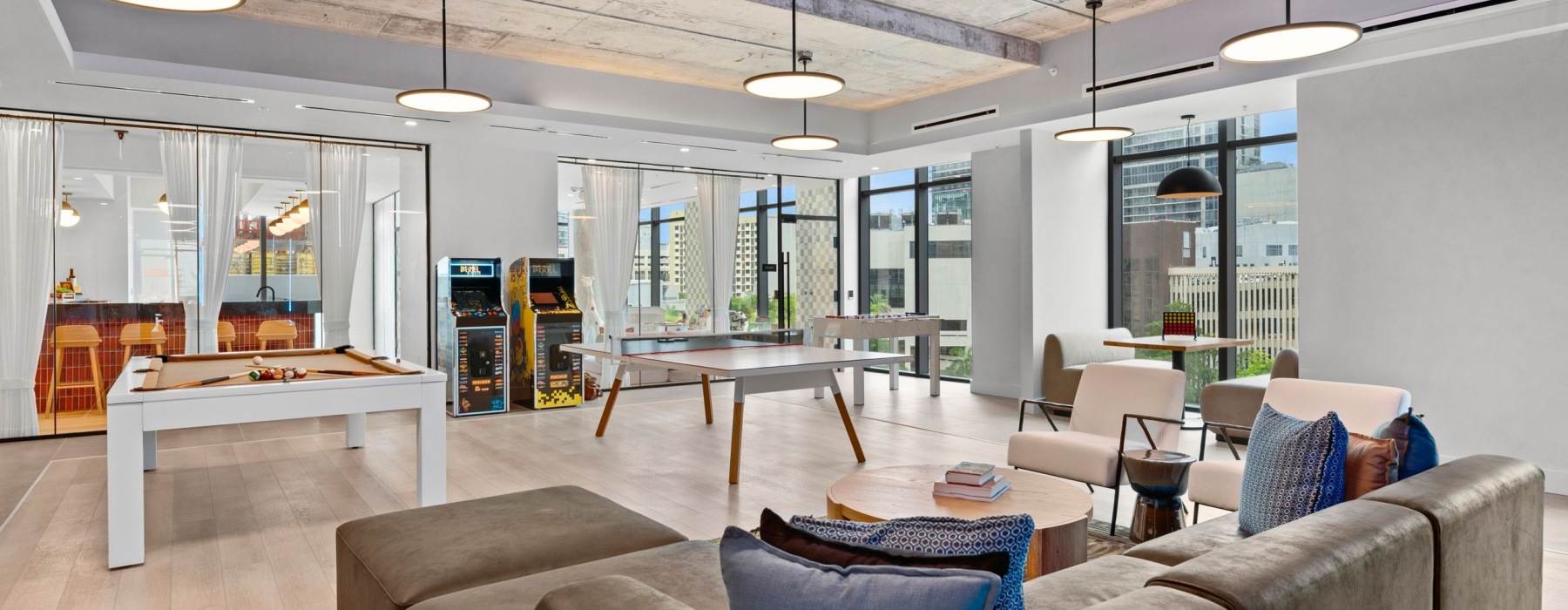 a room with a couch and chairs