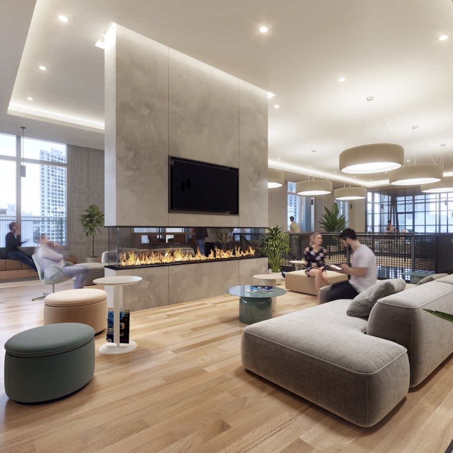 Quick access to state-of-the-art amenities a clubroom with a fireplace, couches and people