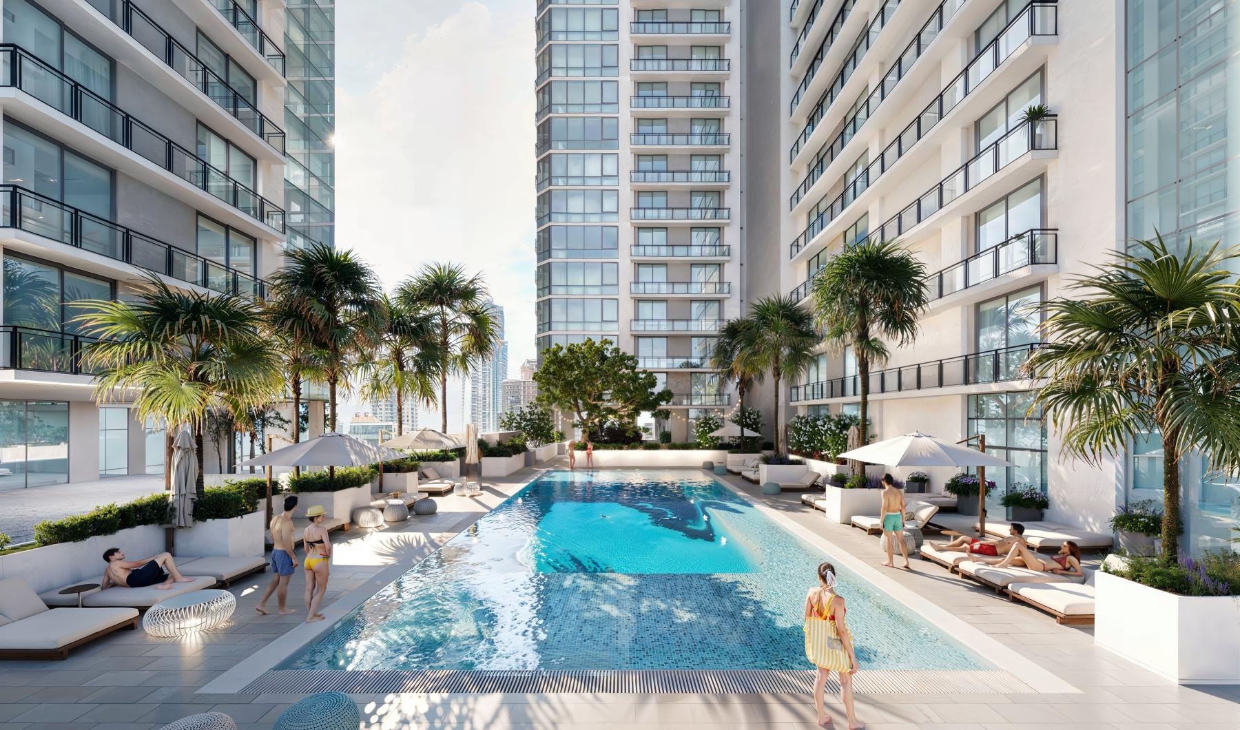 Resort-style swimming pool a pool with lounge chairs and couches