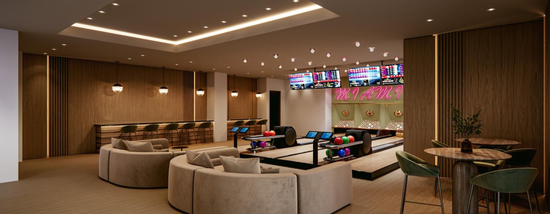 a room with couch and chairs and a bowling alley